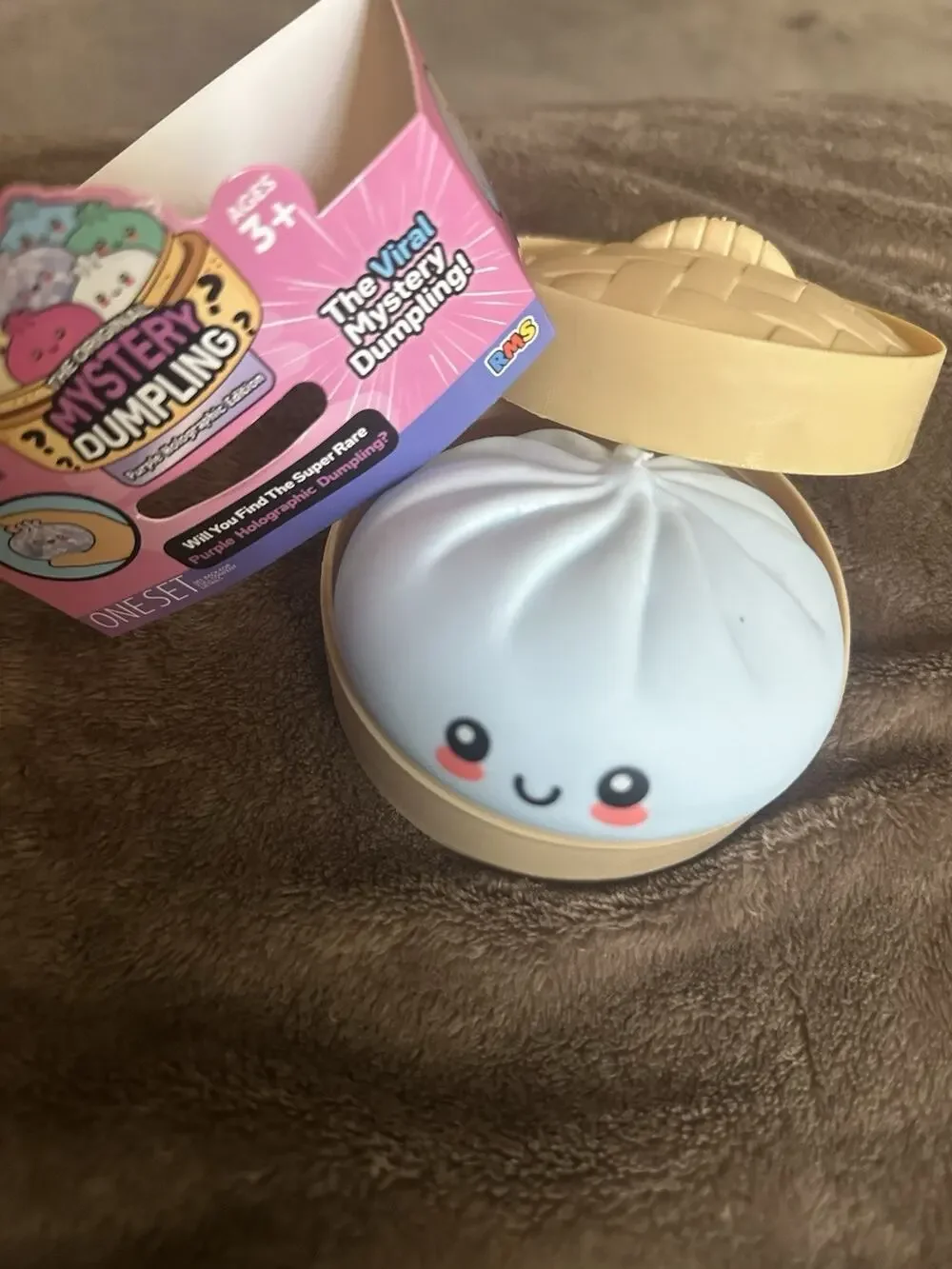 Opened RMS Purple Holographic Viral Mystery Dumpling- Squishy LIGHT BLUE SKY